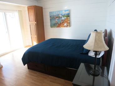 First floor Queen Bedroom facing the oceanfront and has a sliding glass door to the deck