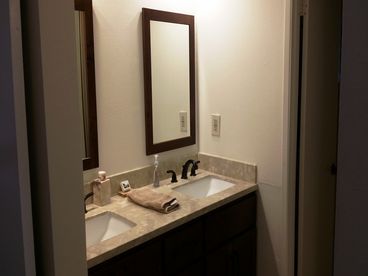 Your master bathroom has a private shower and toilet room, and a double vanity